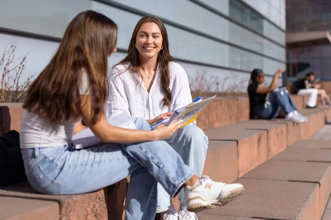 Olivia Pess talking with a friend outside Whitman.